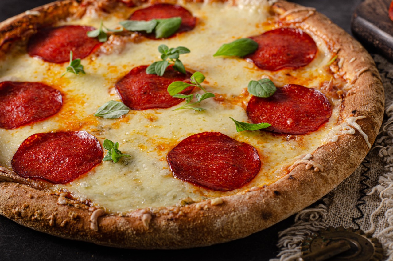 Homemade salami pizza with cheese corners