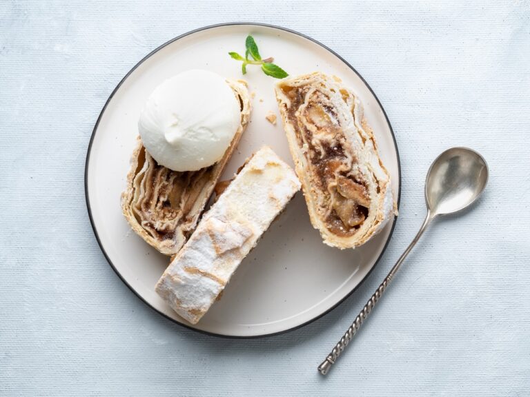 Apple strudel with ice cream and cinnamon. Baked cake, delicious dessert on the table. Top view